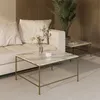 A living room scene with a couch and two marble-top coffee tables. Náhled obrázku produktu