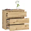 A wooden chest of drawers with three drawers, a vase with flowers on top, and a magazine on the top surface. Produktbild-Vorschau