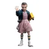 A figurine of Eleven from Stranger Things, holding a yellow box and raising her hand. Náhled obrázku produktu
