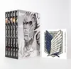 A set of Attack on Titan manga volumes in a slipcase, along with a separate card featuring the Survey Corps emblem. Náhled obrázku produktu