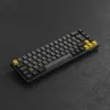 A mechanical keyboard is shown from a diagonal angle on a dark, textured surface. Produktbild-Vorschau