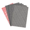 A stack of gasket sheets with a red sheet on top featuring a repeating pattern and a logo. Voir les images du produit