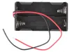 A black plastic battery holder with two AA battery slots, each with a spring terminal. Red and black wires extend from the holder. Anteprima dell’immagine prodotto