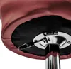 A close-up view of the underside of a bar stool, focusing on the height adjustment mechanism. Produktbild-Vorschau