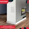 A corner of a room with a modern fireplace and a white access panel on the wall. Produktbild-Vorschau