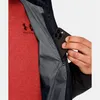 A person is putting a smartphone into the inner pocket of a black jacket. Produktbild-Vorschau