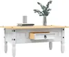 A white and wood coffee table with a drawer, a vase of greenery, and books on top, set against a white background. Náhľad obrázku produktu