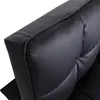 A close-up view of the corner of a black leather sofa cushion. Produktbild-Vorschau
