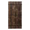A panel of dark brown bamboo poles bound together with black rope, presented against a white background. Anteprima dell’immagine prodotto