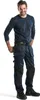 A man wearing work pants and a long-sleeved shirt, posing against a white background. Produktbild-Vorschau