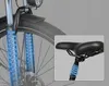 Close-up of an electric bike's front suspension and seat post, highlighting the shock absorption features with blue glowing coils. Voir les images du produit