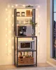 A kitchen baker's rack with appliances and bottles displayed. Náhled obrázku produktu