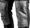 Close-up of the knee area of black work pants with gray reinforced panels. Produktbild-Vorschau