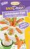 A package of chocolate carrot decorations for baking, shown with some of the decorations on a cake and cupcake. Náhľad obrázku produktu