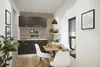 A small, modern kitchen with a dining nook. Produktbild-Vorschau