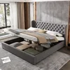 A bedroom scene with a bed featuring a tufted headboard and storage underneath. Produktbild-Vorschau