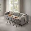 Two folding tray tables are placed in front of a gray sofa in a living room setting. Produktbild-Vorschau