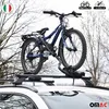 A blue bicycle is mounted on a car's roof rack, with trees in the background. Náhľad obrázku produktu