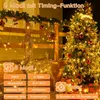 Christmas decorations with string lights, a reindeer figure, and a Christmas tree. Produktbild-Vorschau