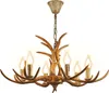 A chandelier made of faux antlers with six candle-shaped lights. Podgląd zdjęcia produktu