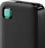 Close-up of a black power bank with a teal button. Náhled obrázku produktu