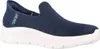 A side view of a navy blue Skechers slip-on sneaker with a white sole. Produktbild-Vorschau