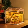 A miniature dollhouse kitchen scene with a greenhouse-style roof. Podgląd zdjęcia produktu