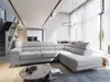 A modern living room with a large sectional sofa, coffee table, and dining area visible in the background. Produktbild-Vorschau