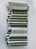 A folded awning valance with green and white stripes lies on a white surface. Produktbild-Vorschau