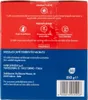 The image shows the side panel of a coffee pod box, detailing origin, preparation instructions, product information, and manufacturer details. Produktbild-Vorschau