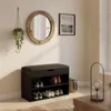 A shoe cabinet with a seat in a hallway, next to a mirror and a framed picture. Náhľad obrázku produktu