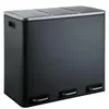A dark gray three-compartment trash can with silver pedal levers and a silver rim around the top. Voir les images du produit