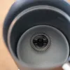 Close-up interior view of a milk frother with its whisk attachment. Produktbild-Vorschau