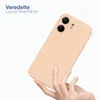 A hand holding a peach-colored phone case against a white background. Produktbild-Vorschau