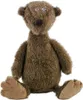 A brown teddy bear sits on a white background. Podgląd zdjęcia produktu