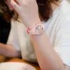 A person wearing a pink watch. Produktbild-Vorschau