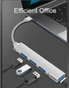 A silver USB hub with multiple ports is connected to a laptop, with other USB devices shown nearby. Produktbild-Vorschau