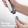 Hands assembling a shower head attachment. Produktbild-Vorschau