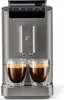 A Tchibo coffee machine with two cups of coffee. Produktbild-Vorschau