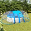 A round swimming pool covered by a transparent dome with a blue canopy, set up on a grassy lawn. Náhled obrázku produktu