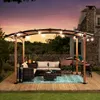 An outdoor patio scene at dusk with a pergola, seating area, and grill. Produktbild-Vorschau