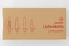 A cardboard box with illustrations of different candle holders and text about the product. Produktbild-Vorschau