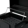 A close-up view of the interior of a black charcoal grill, showing the main grilling grate and a secondary warming rack. Produktbild-Vorschau