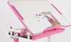 A pink and white adjustable children's desk with a drawer and two open books on its surface. Produktbild-Vorschau