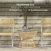 Two rattan chairs and a rattan side table with a glass top are set up on a patio against a shingled wall. Produktbild-Vorschau