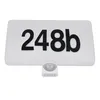 A white house number sign with black numbers and a motion sensor. Náhľad obrázku produktu