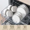 A set of white ceramic dishes with black rims are neatly arranged in a dishwasher rack. Voir les images du produit