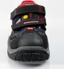 Close-up front view of a black safety sandal with red and blue accents. Produktbild-Vorschau
