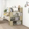 A bookshelf room divider is shown in a living room setting, with books and decorative items on its shelves. Produktbild-Vorschau