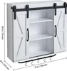 A white bathroom cabinet with sliding barn doors and metal hooks below. Voir les images du produit